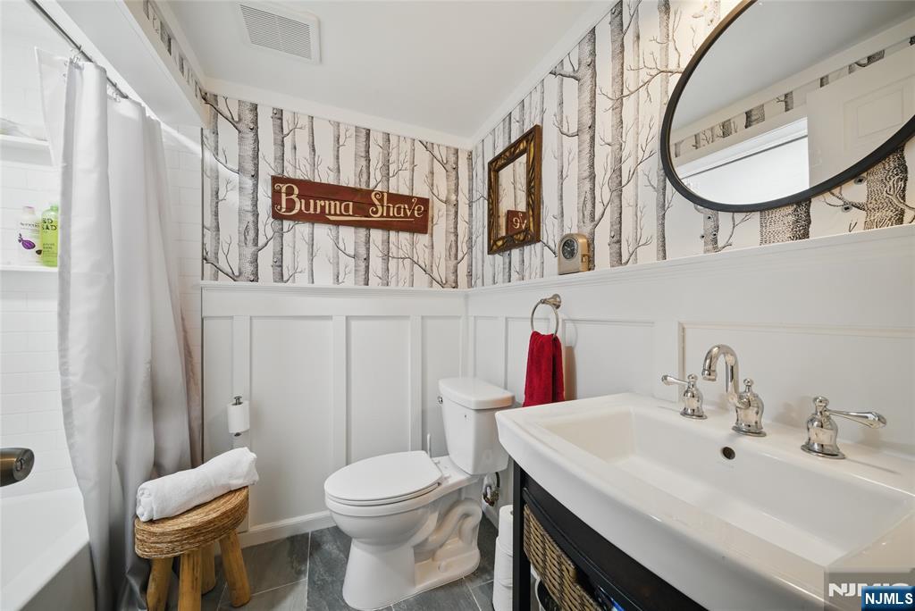 351 Franklin Road Denville, NJ 07834 - Photo 36 of 45 a bathroom with a toilet a sink and a mirror