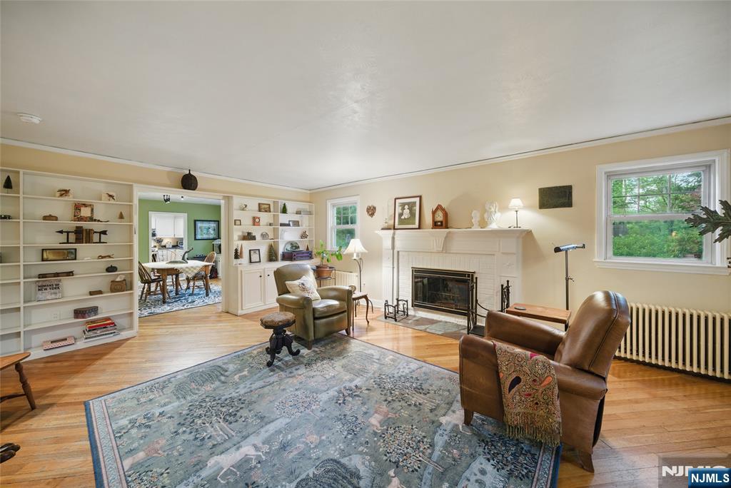 351 Franklin Road Denville, NJ 07834 - Photo 4 of 45 a living room with furniture large window and a fireplace