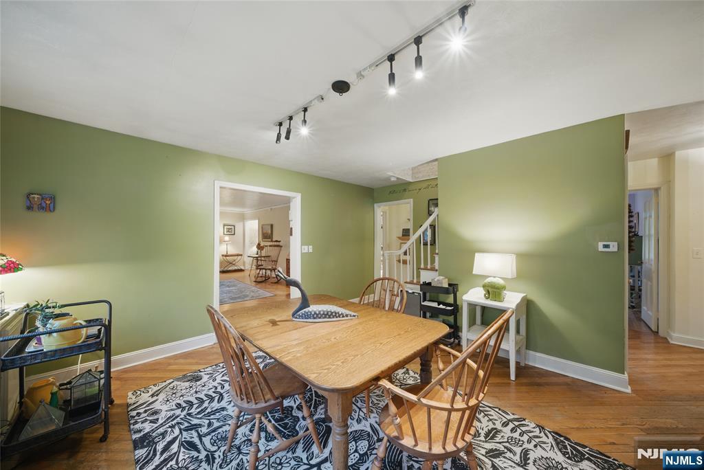 351 Franklin Road Denville, NJ 07834 - Photo 10 of 45 a dining room with a table and chairs
