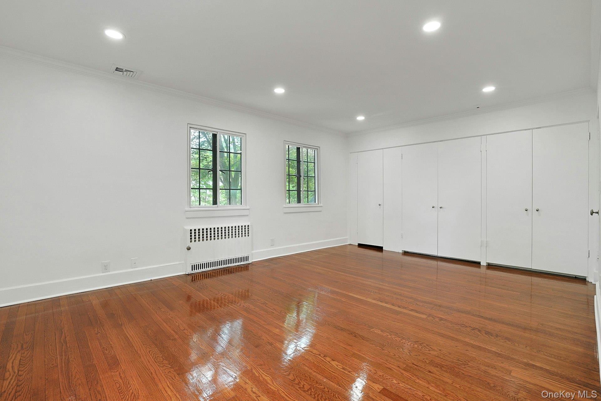 14 Withington Road Scarsdale, NY 10583 - Photo 21 of 41 an empty room with wooden floor and windows