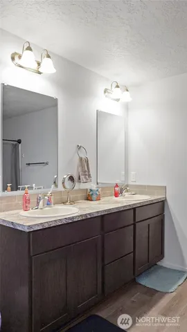 a bedroom with a bed and a mirror