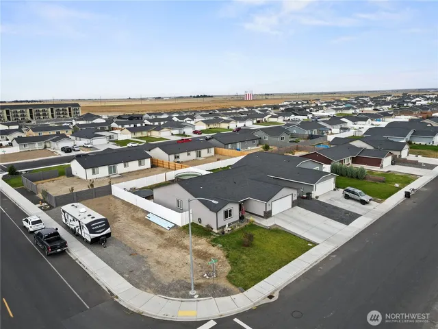 an aerial view of a house with outdoor space