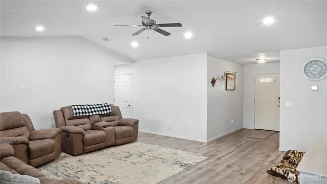 a view of livingroom with hardwood floor and a ceiling fan