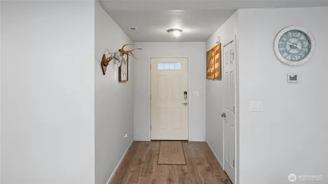 a bedroom with a bed and a television