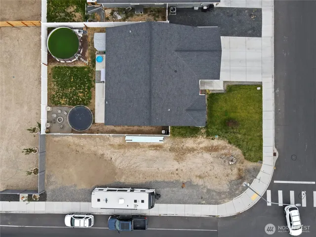 an aerial view of a house with a swimming pool