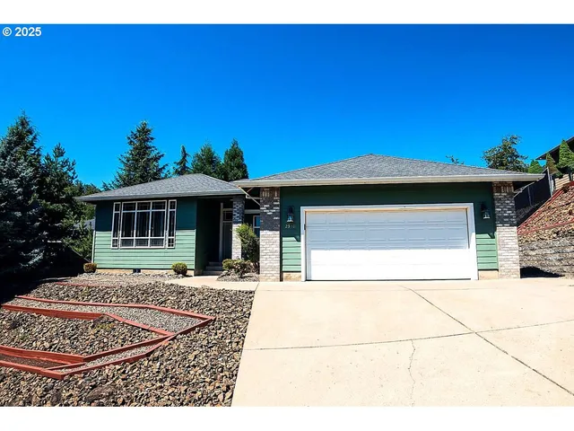 a front view of a house with yard