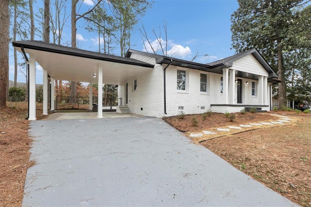 1613 Folkstone Road Northeast Brookhaven, GA 30329 - Photo 1 of 1 a view of a house with a outdoor space