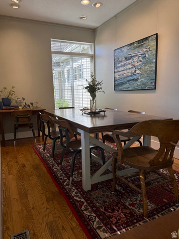 776 Canyon Road Hyde Park, UT 84318 - Photo 10 of 57 Dining area featuring hardwood flooring, recessed lighting, crown molding, and a window with plantation shutters