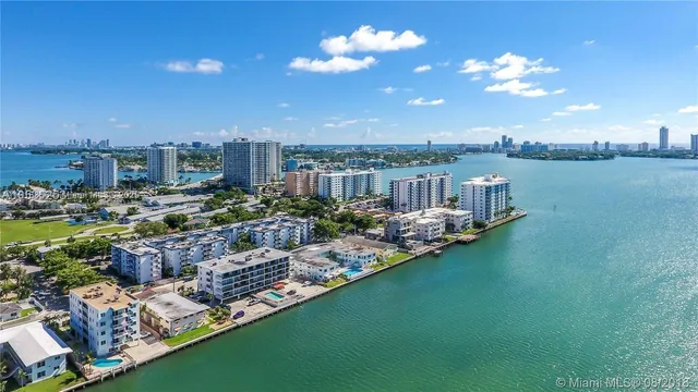 a view of a lake with a house in the background