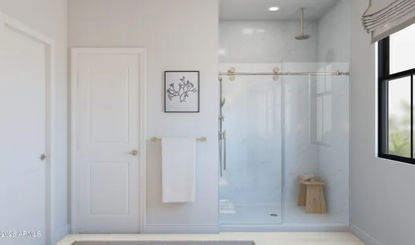 a bathroom with a double vanity sink a mirror and a bathtub