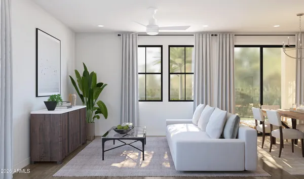a living room with furniture and a rug