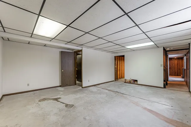 view of living room with furniture and a floor to ceiling window