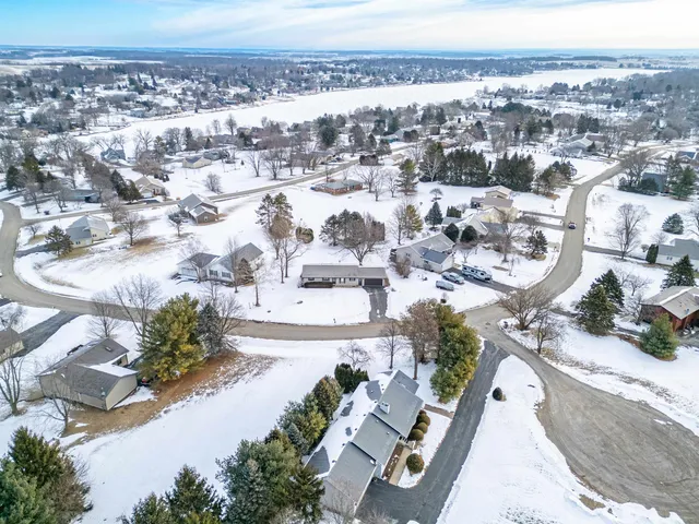 a kitchen with granite countertop wooden cabinets and refrigerator