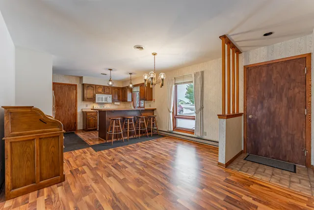 a kitchen with stainless steel appliances granite countertop a sink and a stove