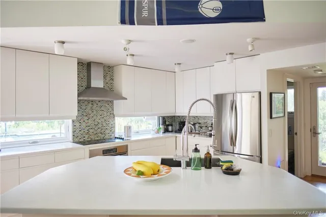 a kitchen with a sink appliances and a counter top space