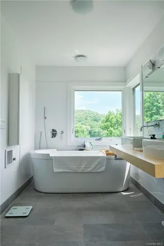 a living room with a couch and a large window