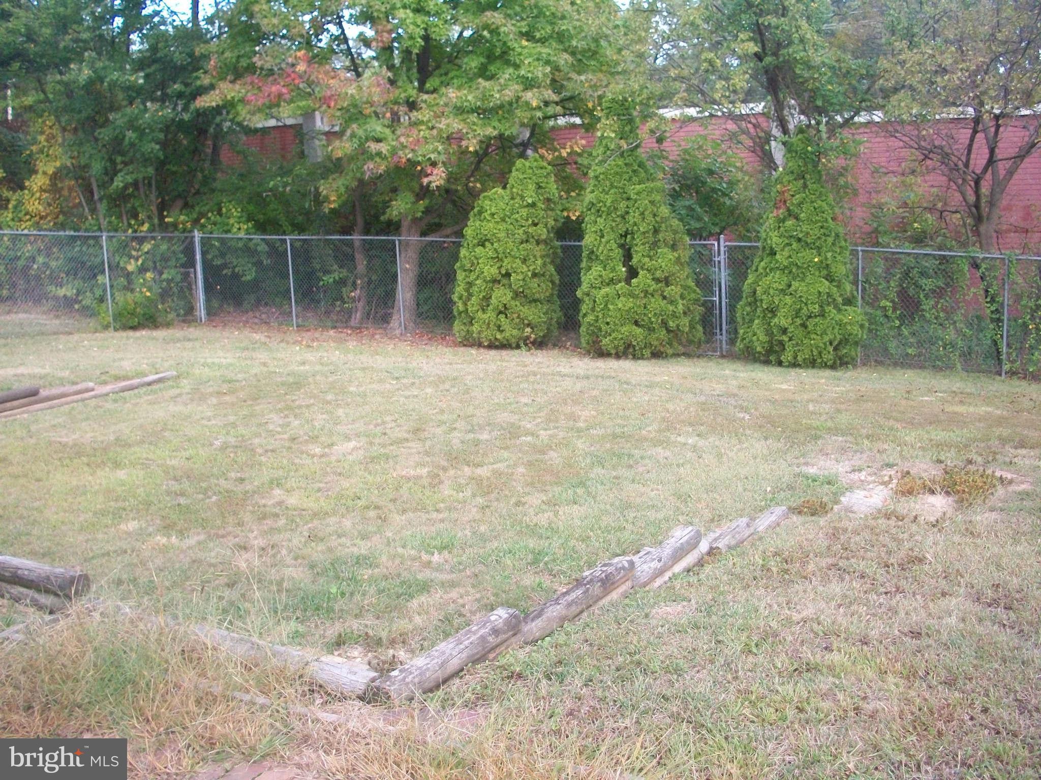 5634 Westgate Road Lanham, MD 20706 - Photo 12 of 12 a backyard of a house with lots of green space