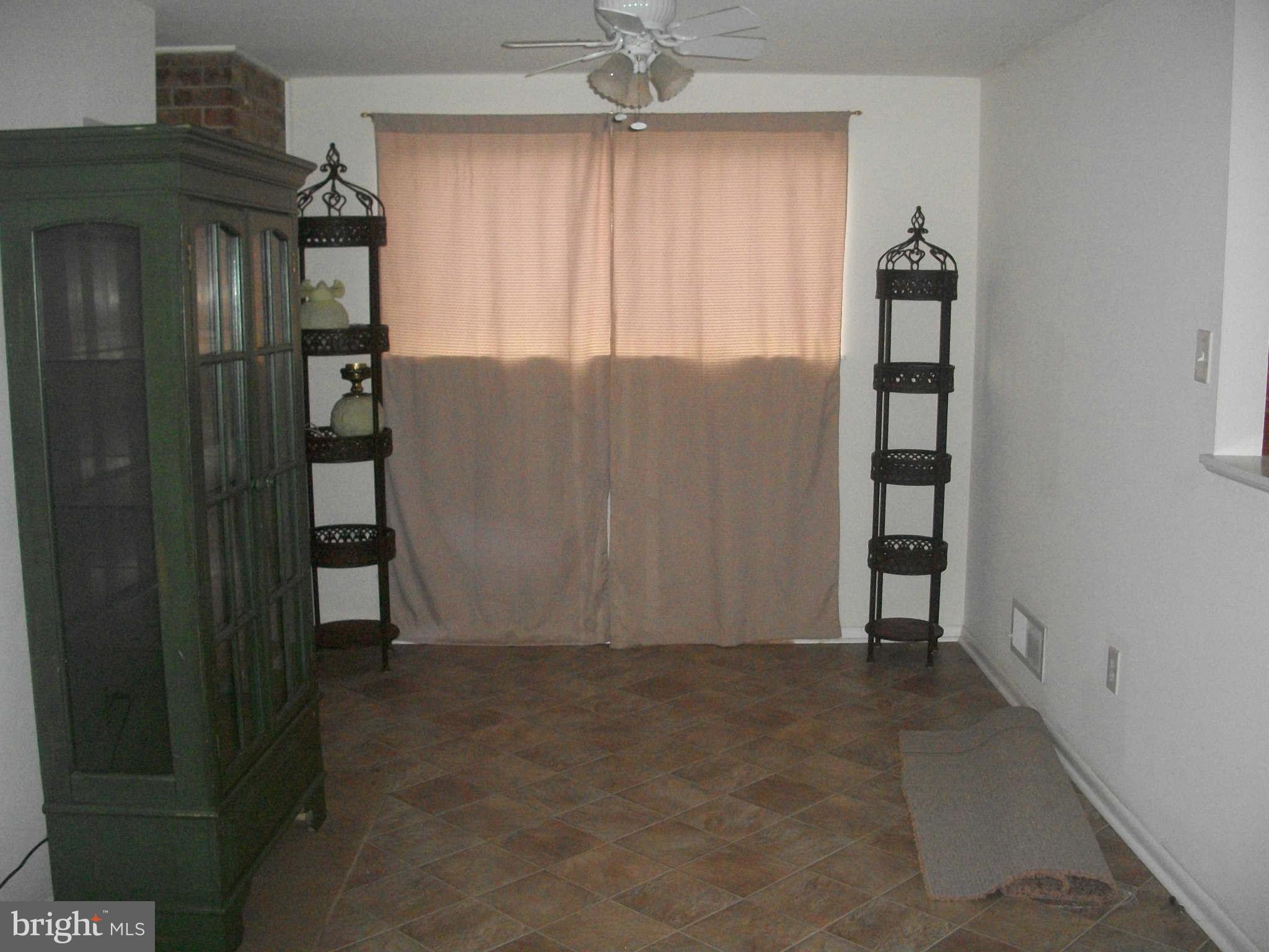 5634 Westgate Road Lanham, MD 20706 - Photo 3 of 12 an empty room with windows and closet