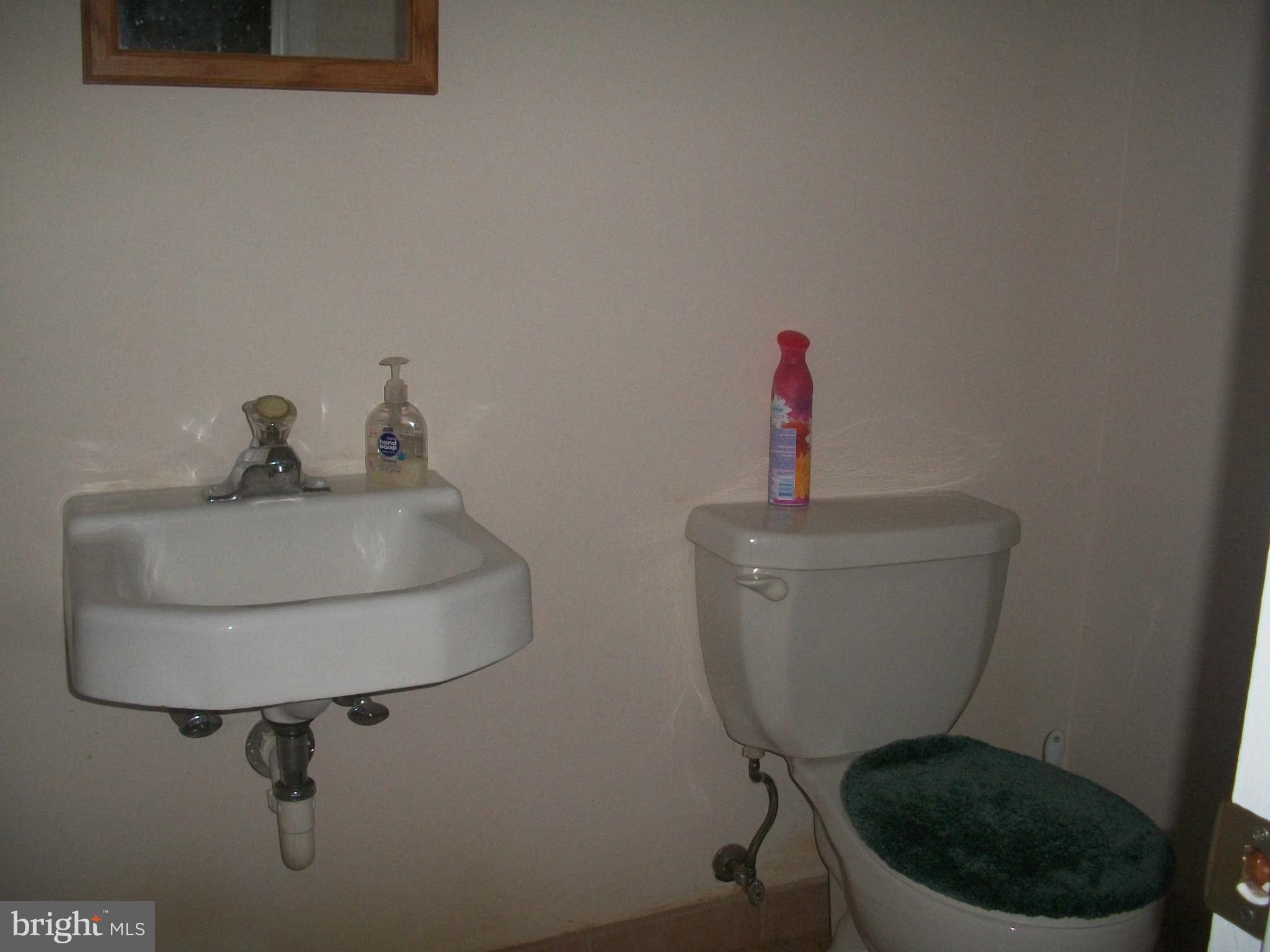 5634 Westgate Road Lanham, MD 20706 - Photo 9 of 12 a bathroom with a toilet and a sink