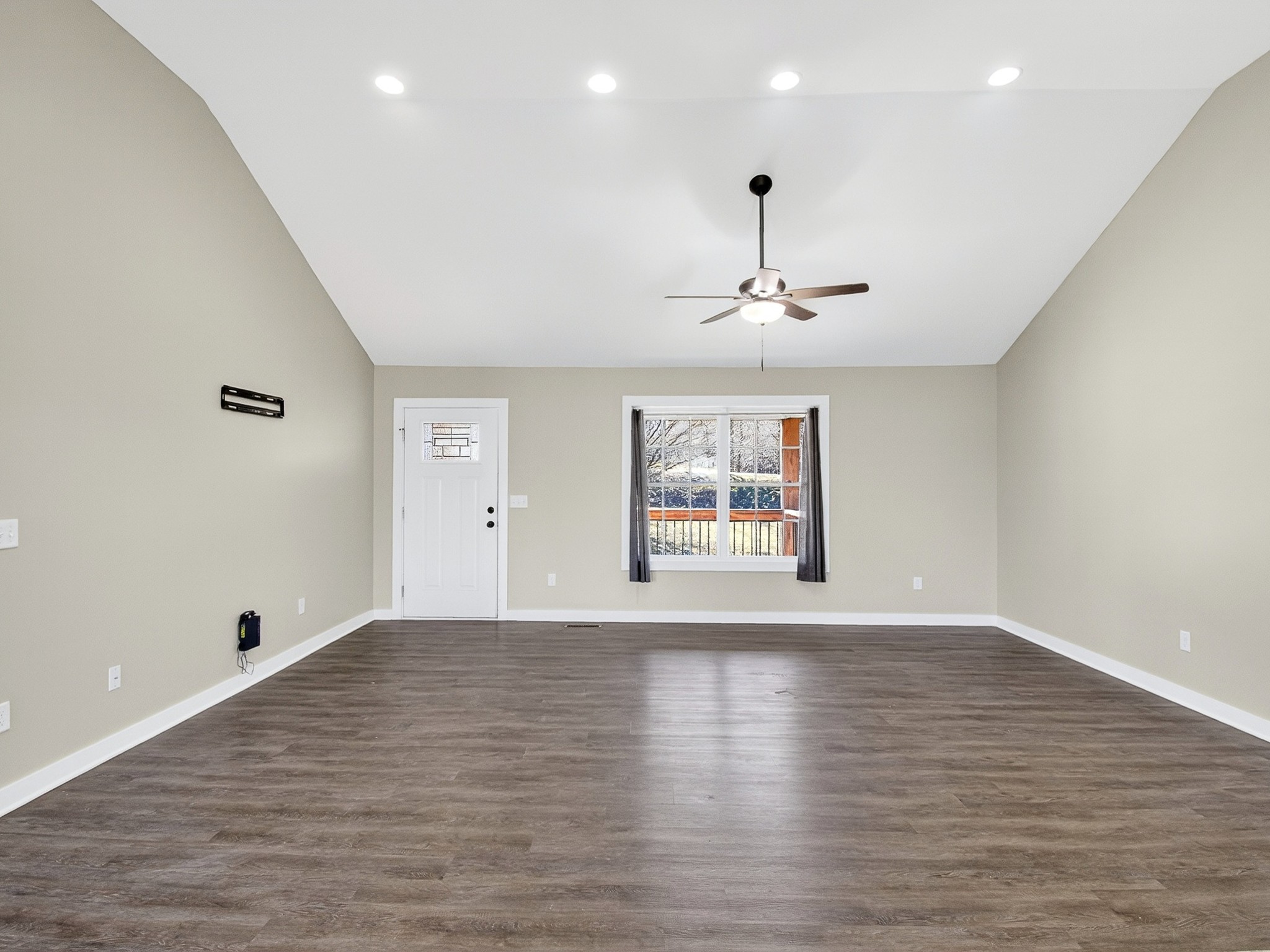 621 Womack Road Bethpage, TN 37022 - Photo 11 of 50 an empty room with wooden floor and windows