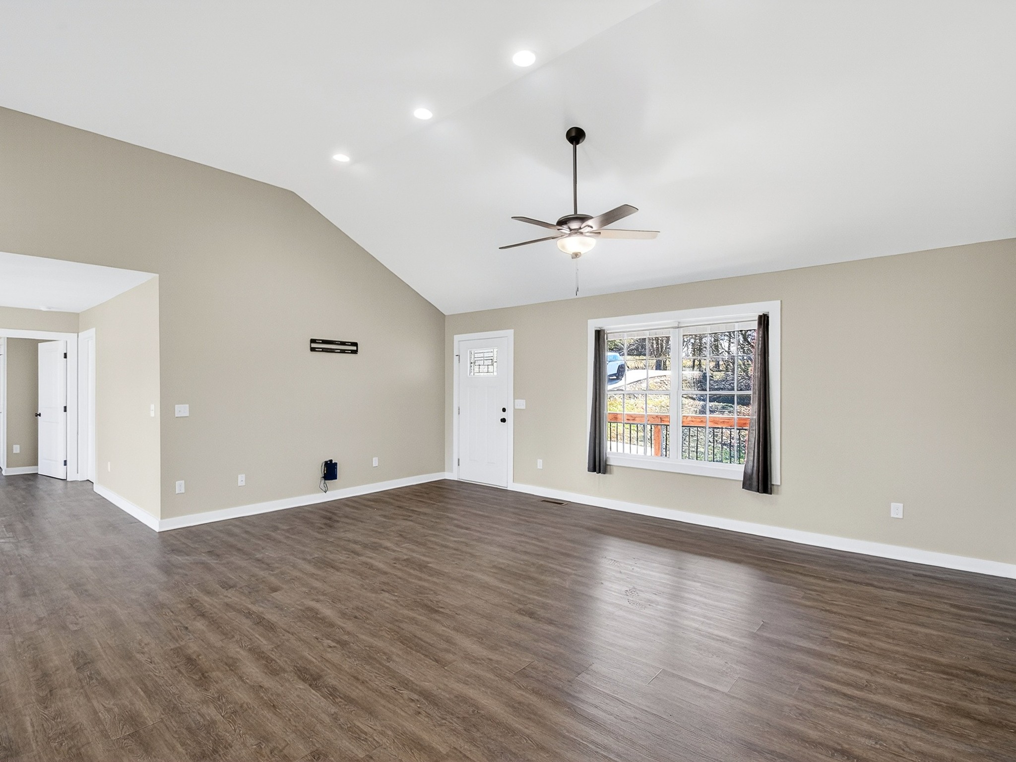 621 Womack Road Bethpage, TN 37022 - Photo 12 of 50 a view of an empty room with wooden floor and a window