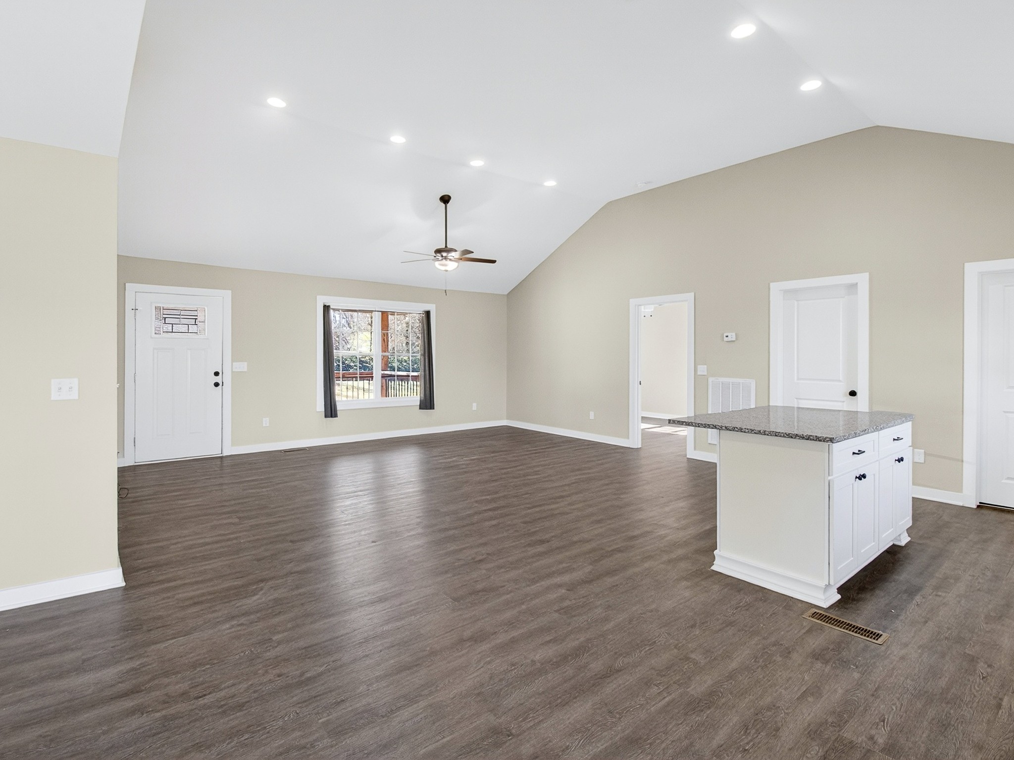 621 Womack Road Bethpage, TN 37022 - Photo 14 of 50 an empty room with wooden floor and windows