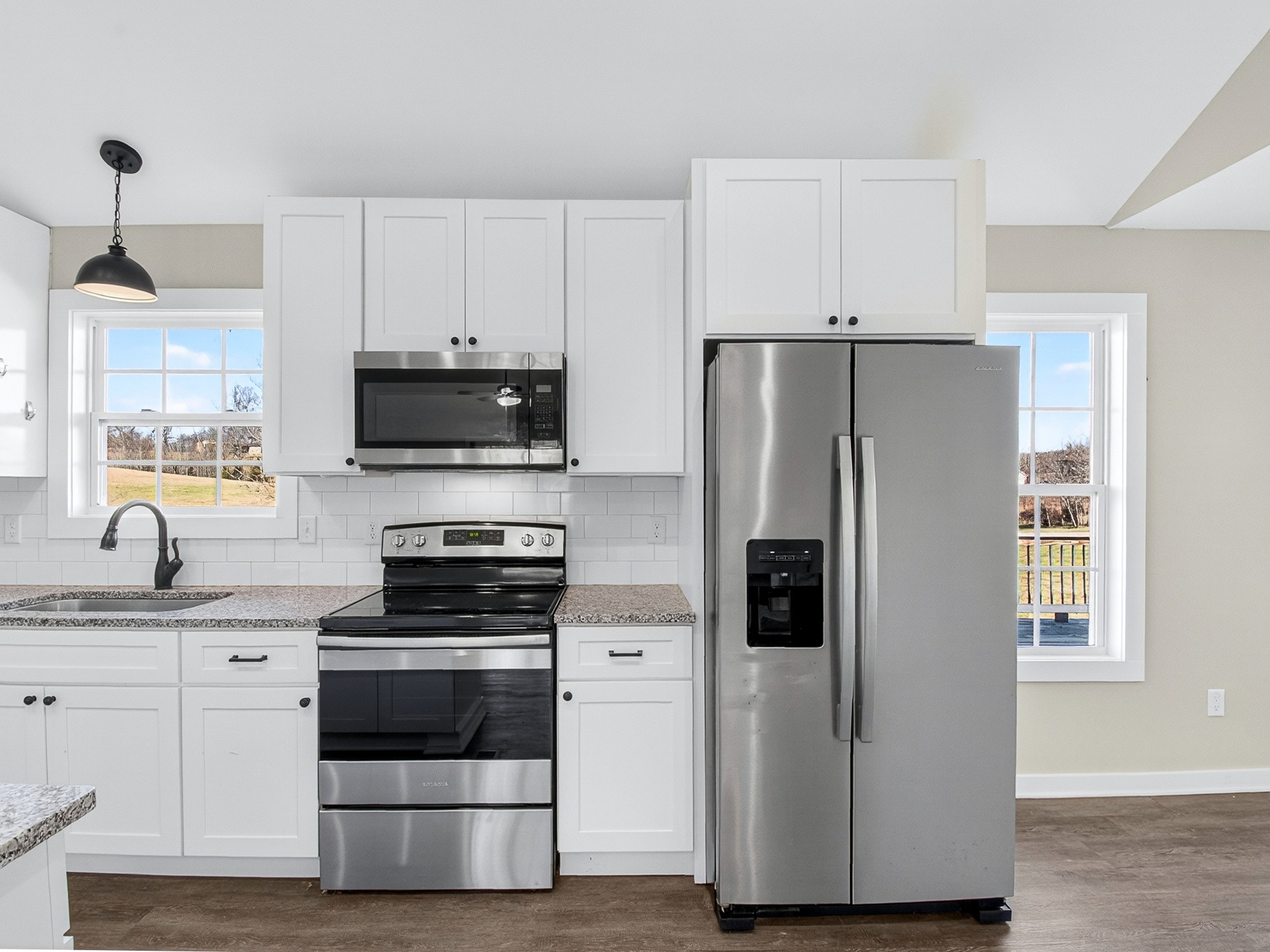 621 Womack Road Bethpage, TN 37022 - Photo 19 of 50 a kitchen with stainless steel appliances a refrigerator stove and sink