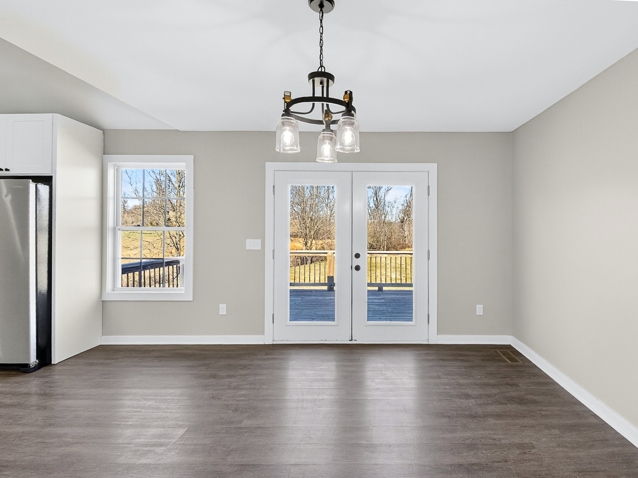 621 Womack Road Bethpage, TN 37022 - Photo 22 of 50 a view of an empty room with wooden floor and a window