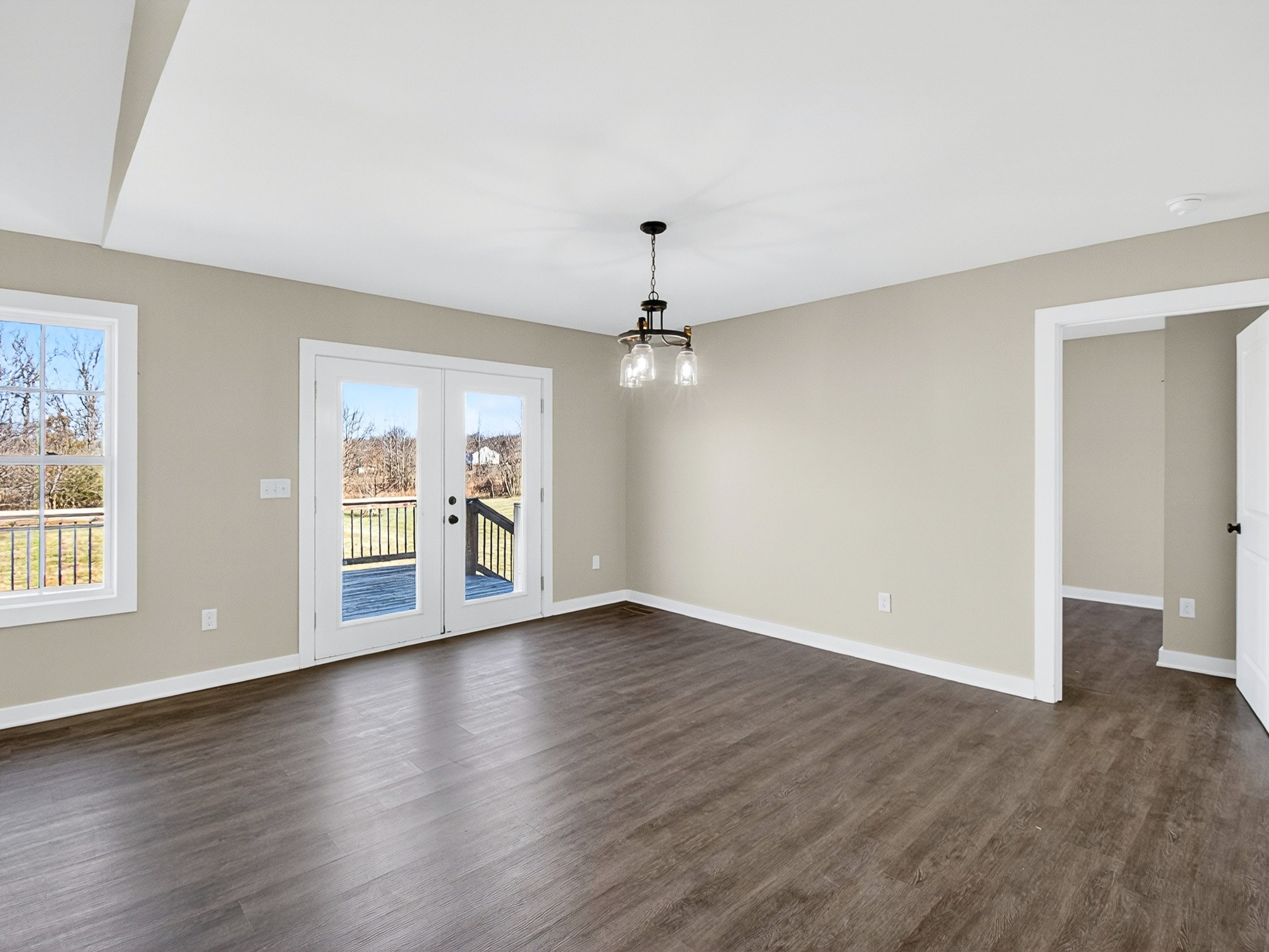 621 Womack Road Bethpage, TN 37022 - Photo 24 of 50 a view of an empty room with wooden floor and a window