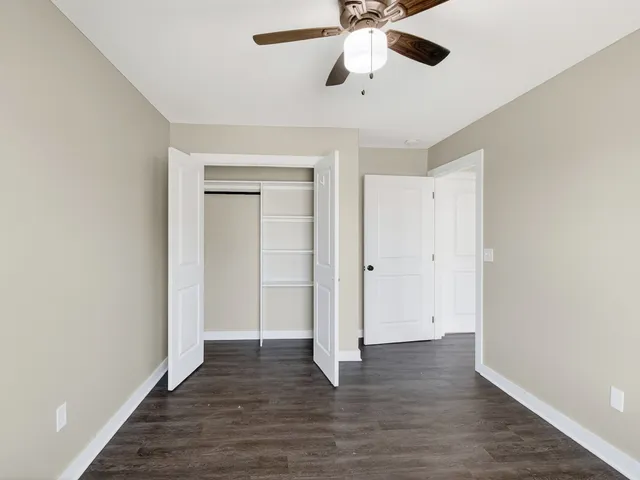 a view of an empty room and wooden floor