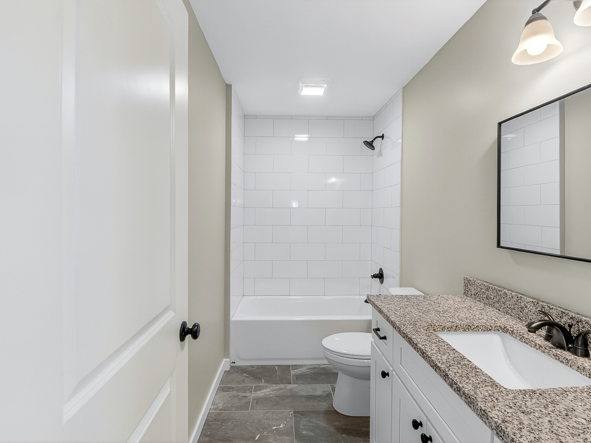 621 Womack Road Bethpage, TN 37022 - Photo 32 of 50 a bathroom with a granite countertop sink toilet tub and shower