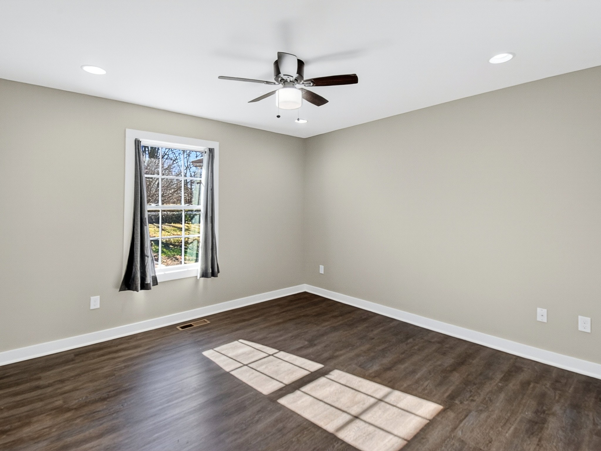 621 Womack Road Bethpage, TN 37022 - Photo 34 of 50 an empty room with wooden floor and windows