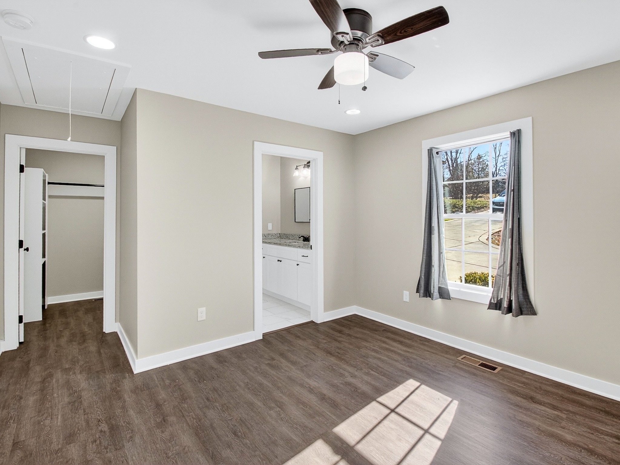 621 Womack Road Bethpage, TN 37022 - Photo 37 of 50 a view of an empty room with wooden floor and a window
