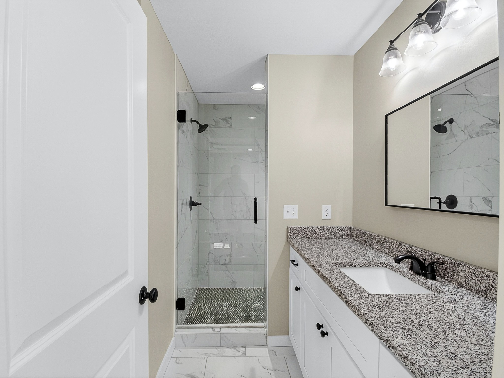621 Womack Road Bethpage, TN 37022 - Photo 38 of 50 a bathroom with a granite countertop sink and shower