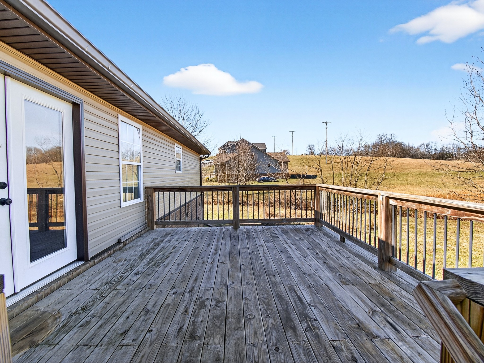 621 Womack Road Bethpage, TN 37022 - Photo 45 of 50 a view of a balcony with wooden floor