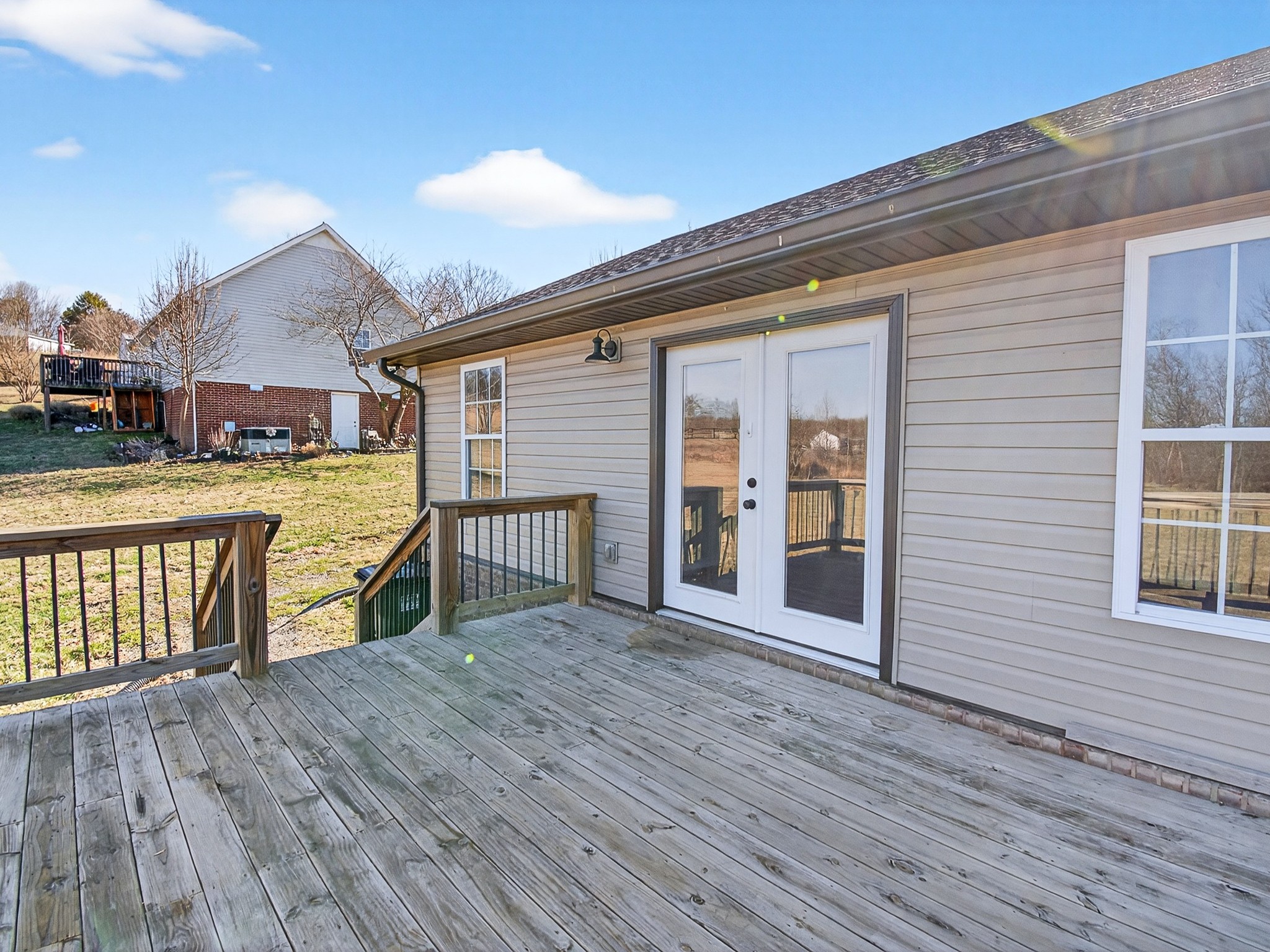 621 Womack Road Bethpage, TN 37022 - Photo 46 of 50 a view of a house with wooden deck