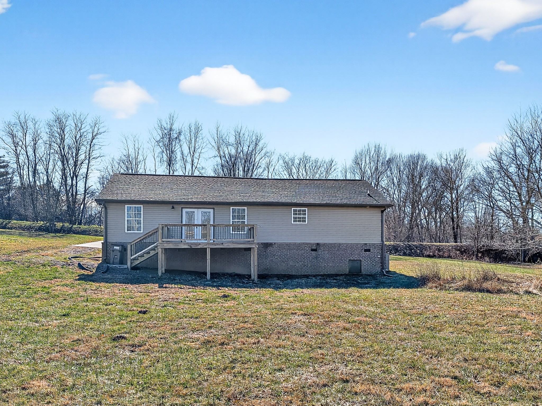 621 Womack Road Bethpage, TN 37022 - Photo 48 of 50 a view of a house with a yard and a large tree in it
