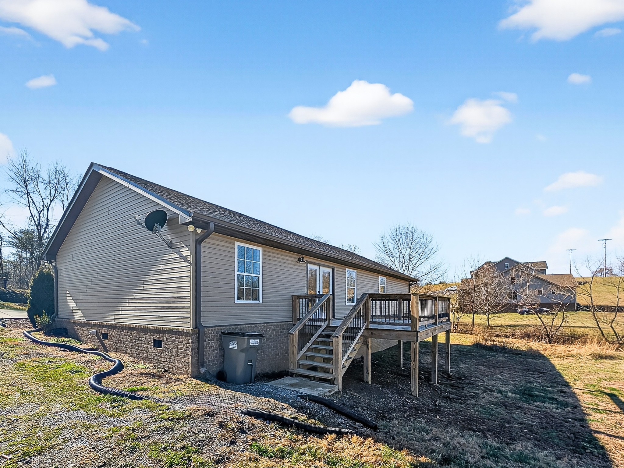 621 Womack Road Bethpage, TN 37022 - Photo 49 of 50 a backyard of a house with table and chairs