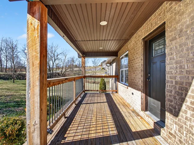 a view of balcony with wooden floor