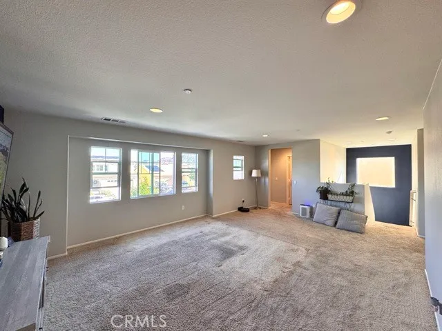 a view of a livingroom with a couch and a large window