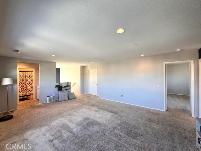 a view of a livingroom with furniture and windows