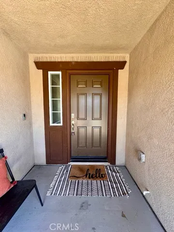 a view of bedroom with bed and glass door
