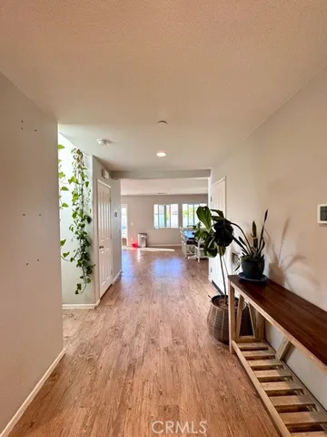 a living room with furniture and flowers