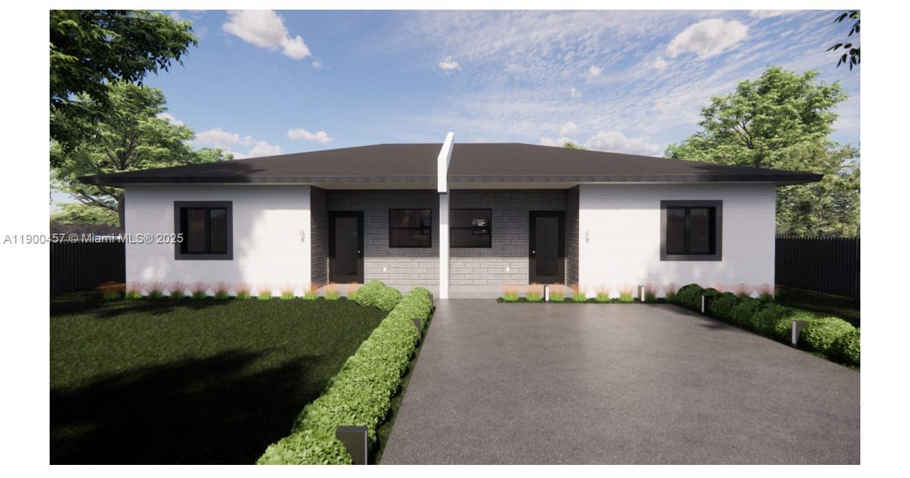 1440-1444 Northeast 147th Street Miami, FL 33161 - Photo 3 of 3 a front view of a house with a yard