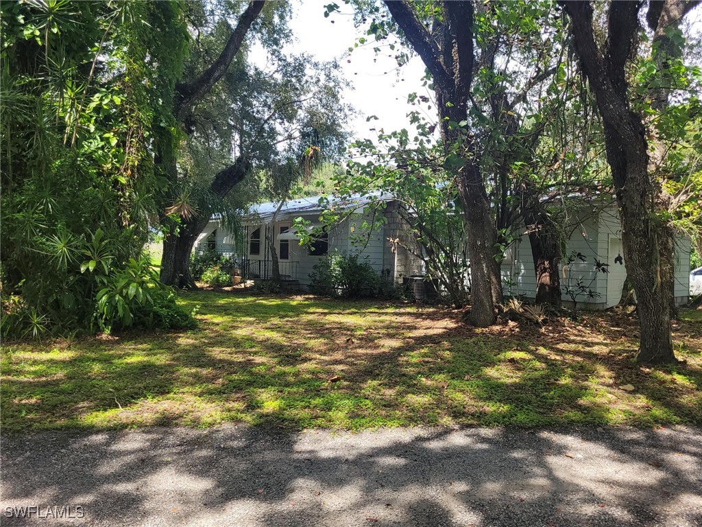2371 County Road 78 LaBelle, FL 33935 - Photo 1 of 17 a view of a yard with a tree