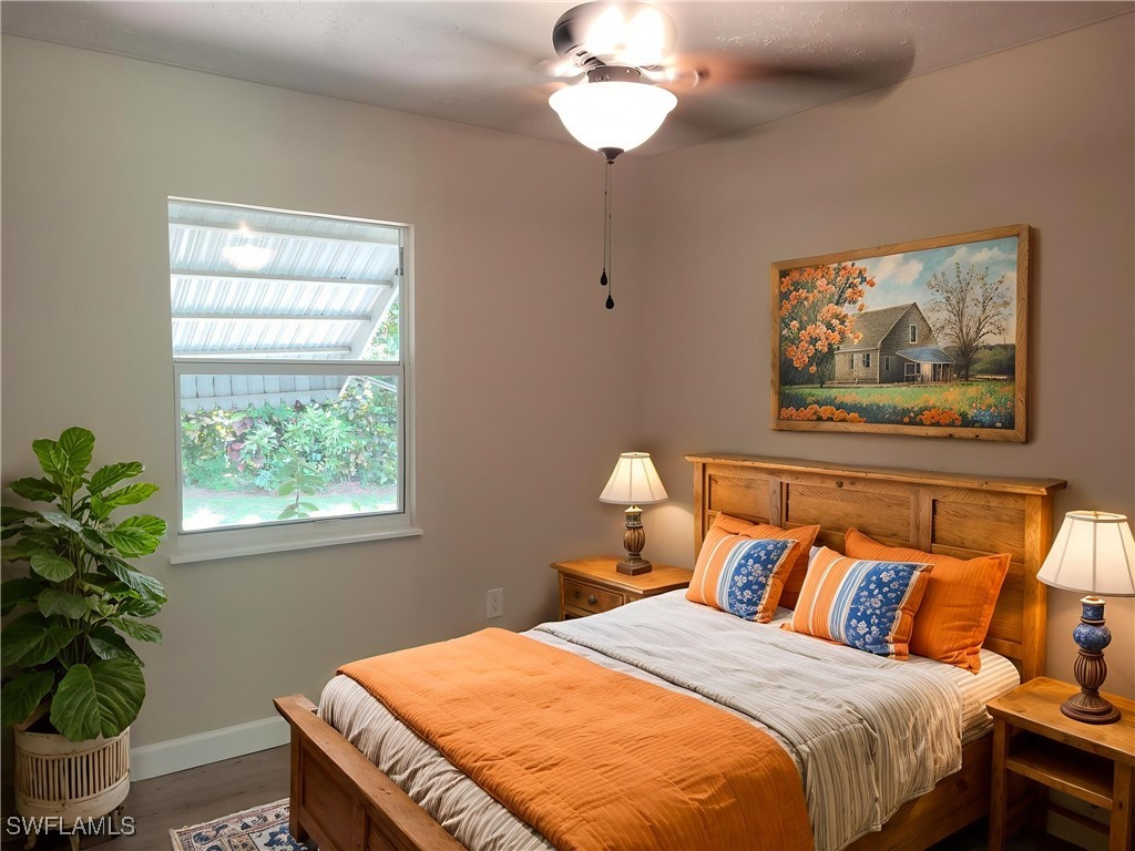 2371 County Road 78 LaBelle, FL 33935 - Photo 11 of 17 a bedroom with a bed and a potted plant