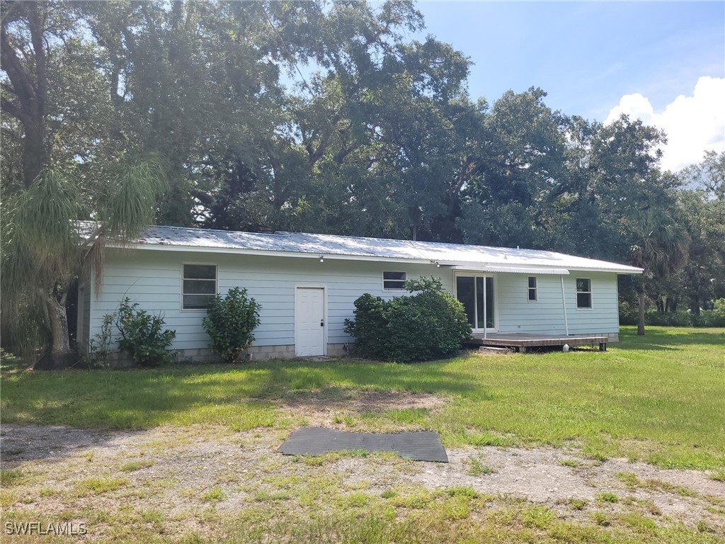 2371 County Road 78 LaBelle, FL 33935 - Photo 16 of 17 a view of a house with a yard and large tree