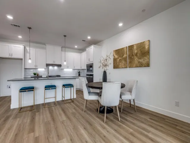 a kitchen with microwave a sink and cabinets