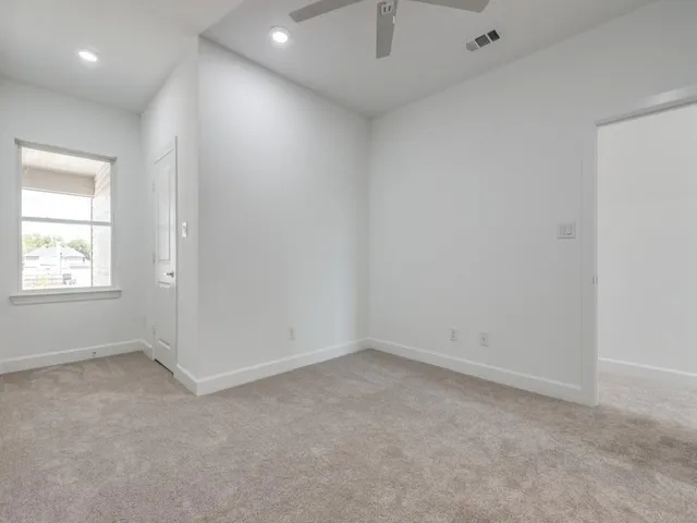 an empty room with a empty space and windows