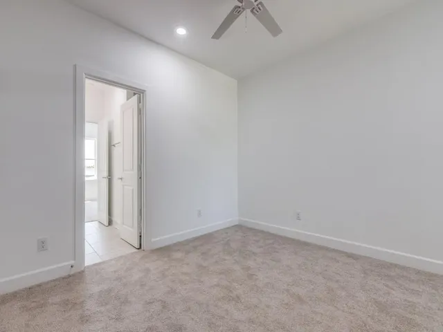 an empty room with a empty space and a window